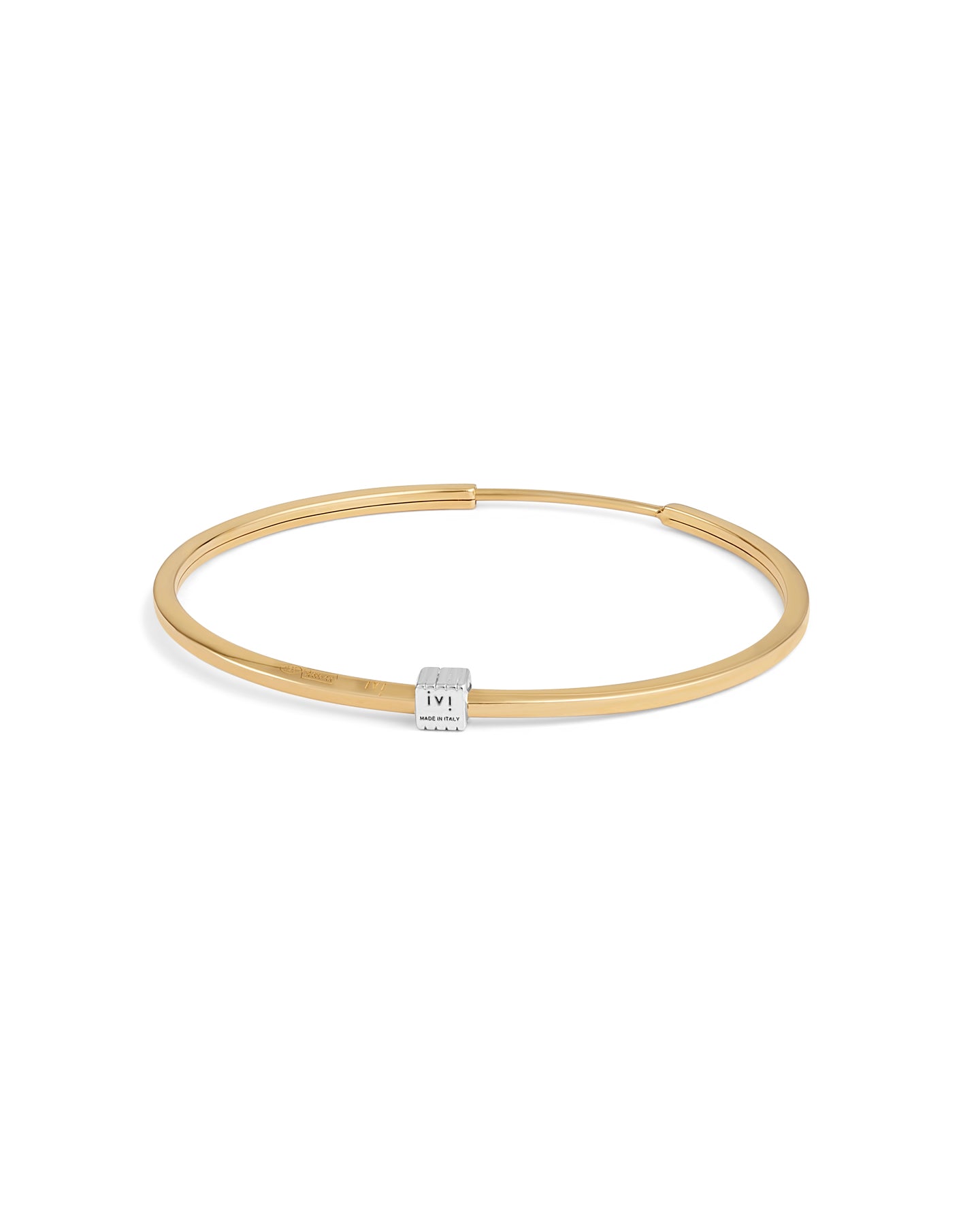 A pair of gold-plated medium-sized hoop earrings with a single engraved cube detail on one side.