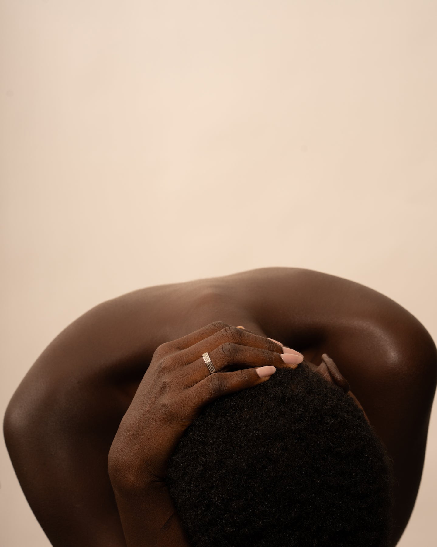 Hexagonal rhodium-plated ring worn by a model.