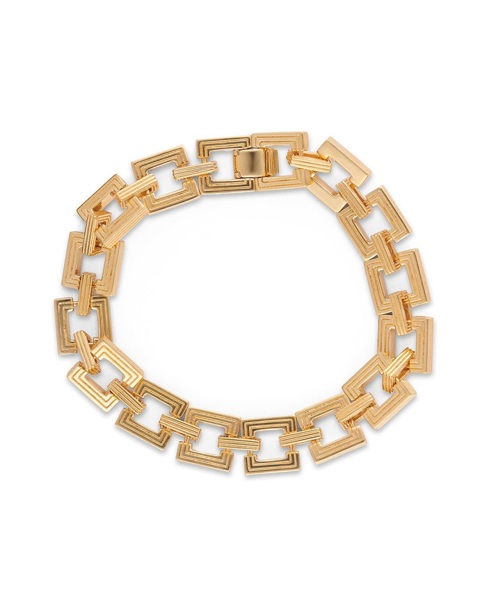 A gold-plated bracelet with interlocking square links, displayed against a white background.