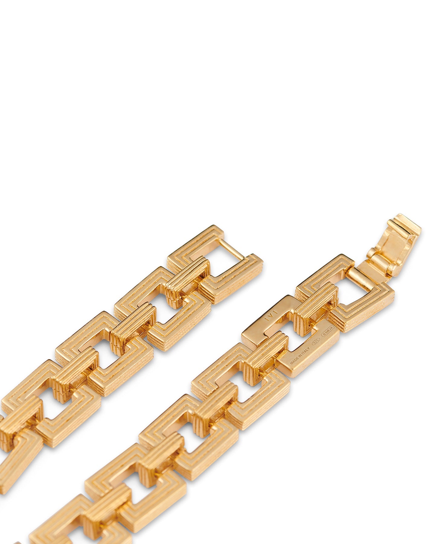 Close-up of gold geometric link bracelet clasp