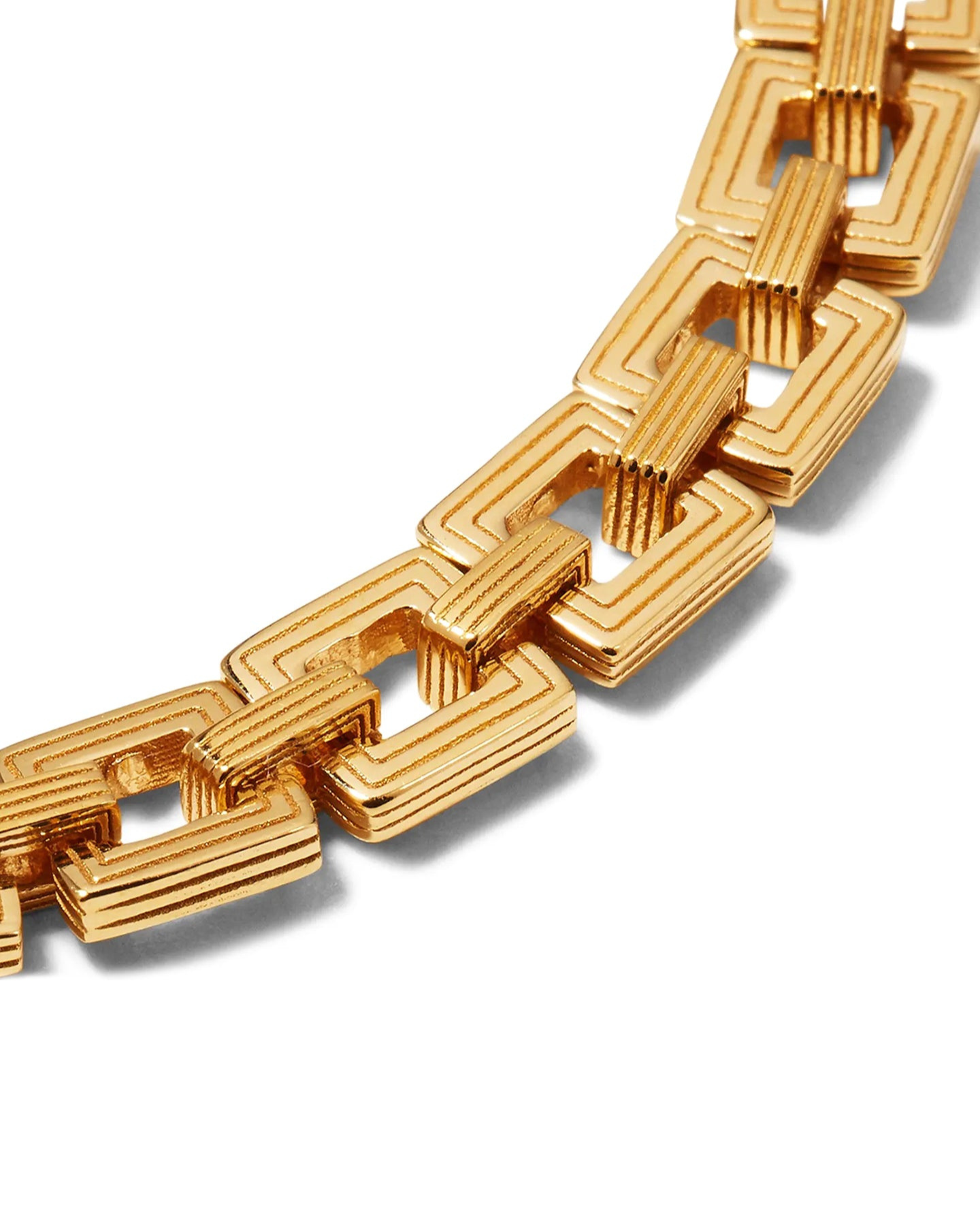 A gold-plated chain choker with interlocking square links.