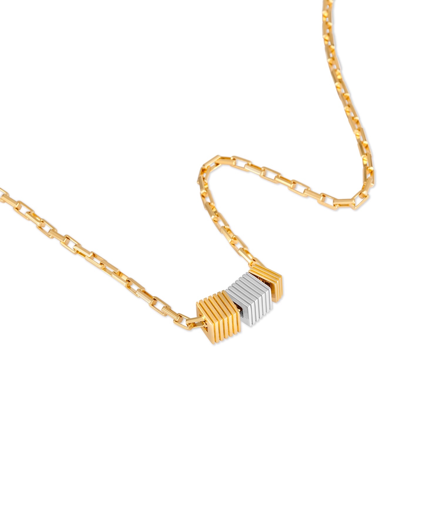 Gold and silver necklace on a white background