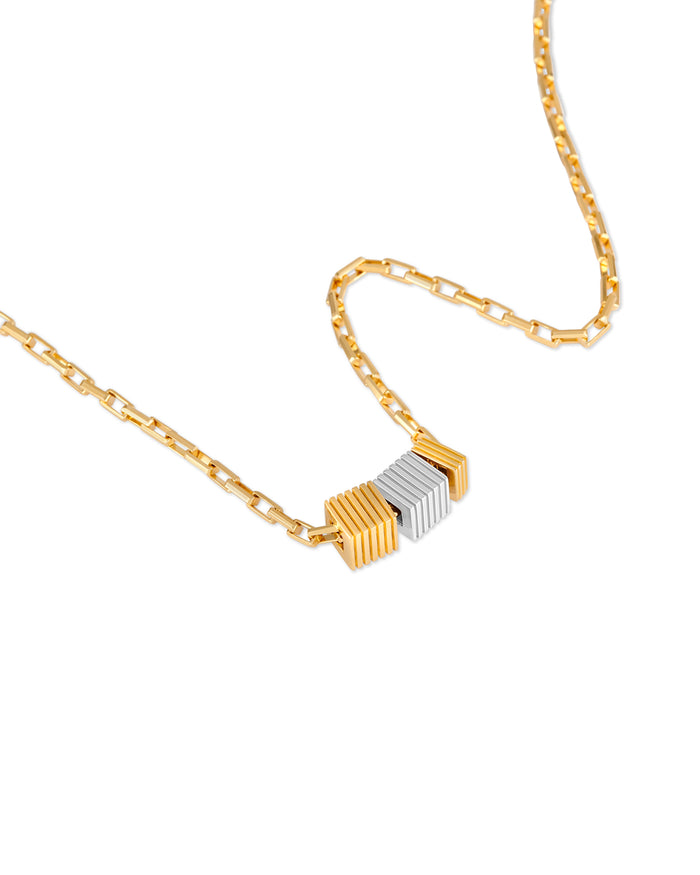 Gold and silver necklace on a white background