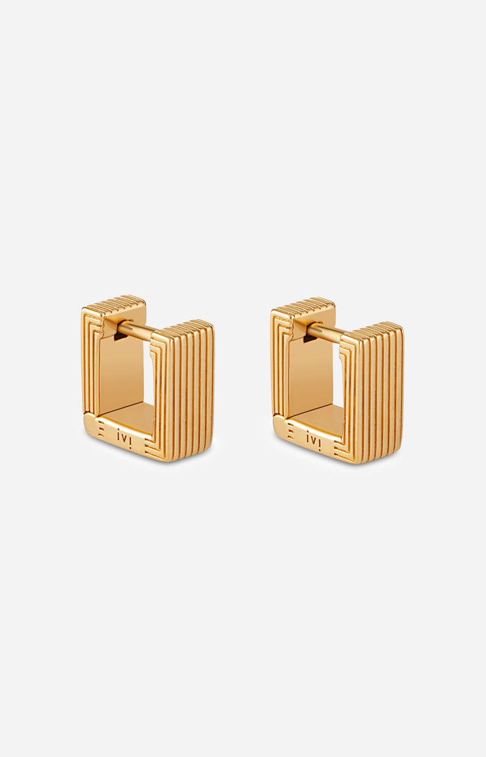 Pair of gold-plated Mini Aurelia sculptural square huggies on a white background.