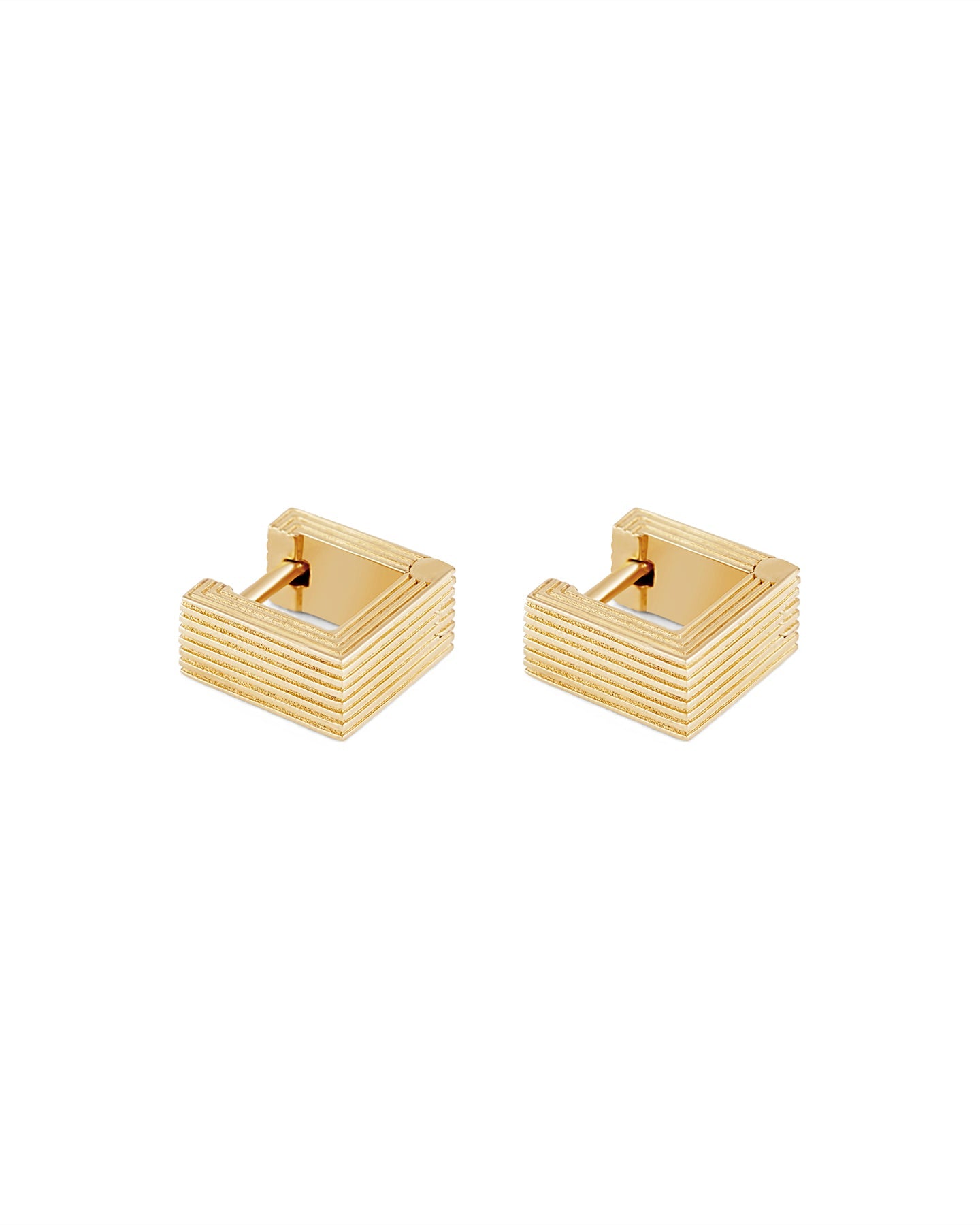 Pair of gold-plated Mini Aurelia sculptural square huggies earrings on a white background.