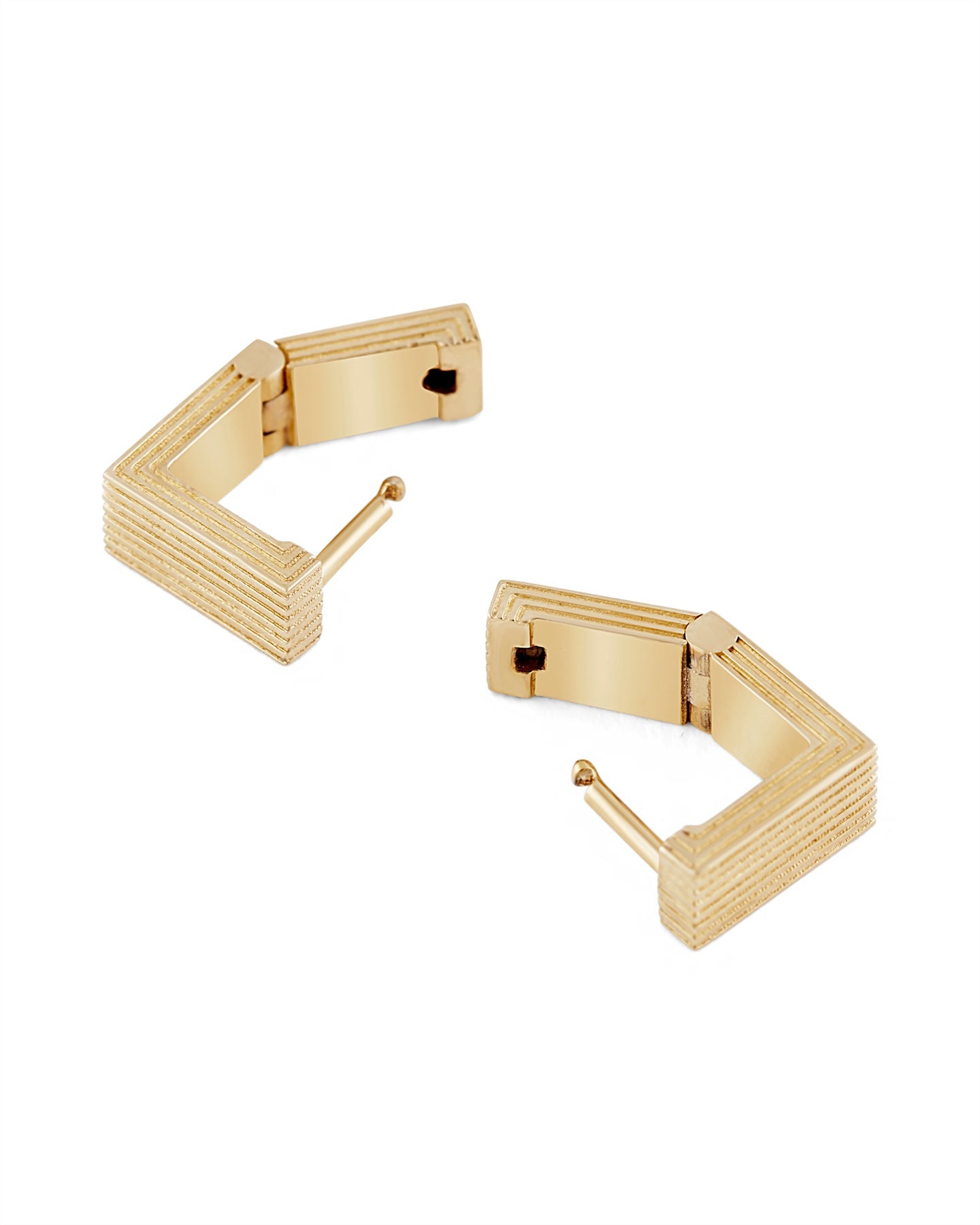 Pair of gold-plated Mini Aurelia sculptural square huggies earrings on a white background.