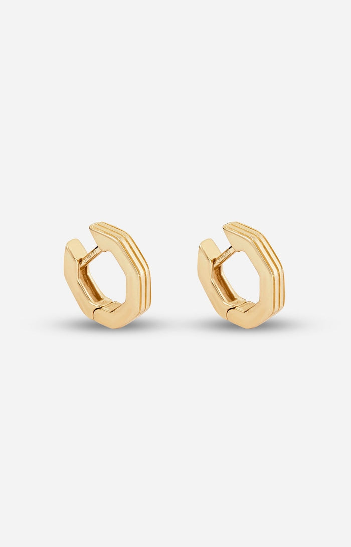 A pair of gold-plated octagon-shaped huggies earrings with linear engravings, displayed against a white background.