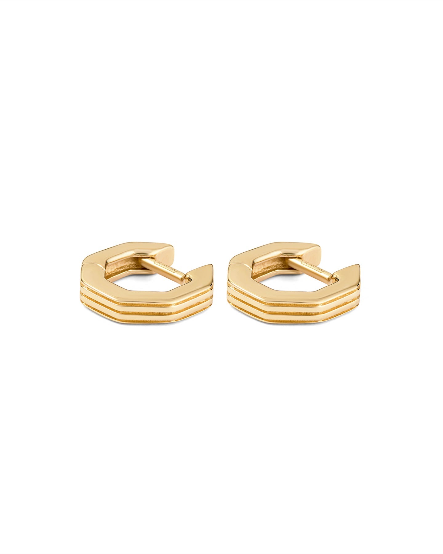 A pair of gold-plated octagon-shaped huggies earrings with linear engravings, displayed against a white background.