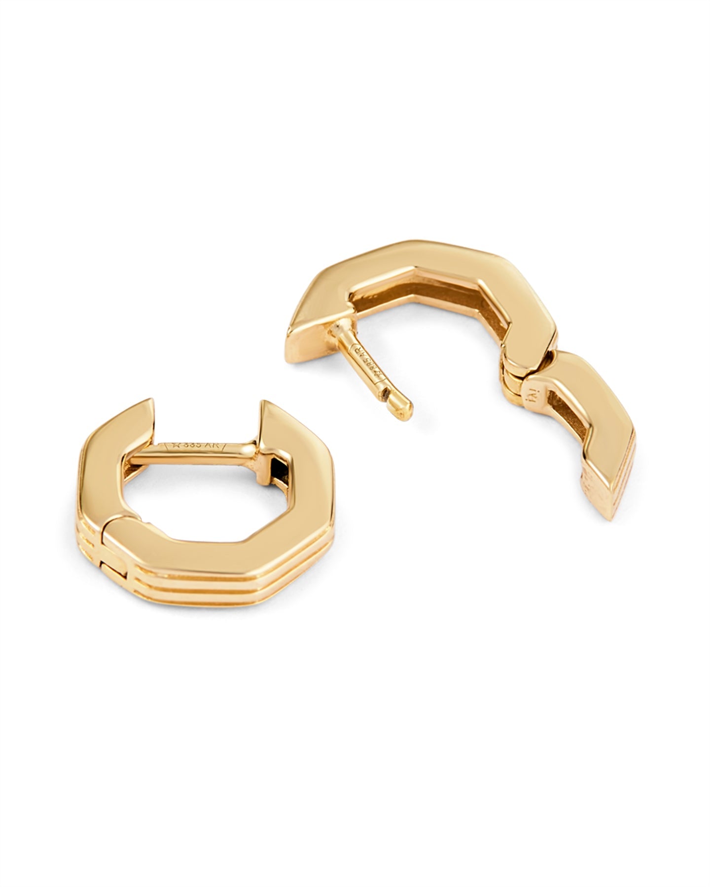 A pair of gold-plated octagon-shaped huggies earrings with linear engravings, displayed against a white background.
