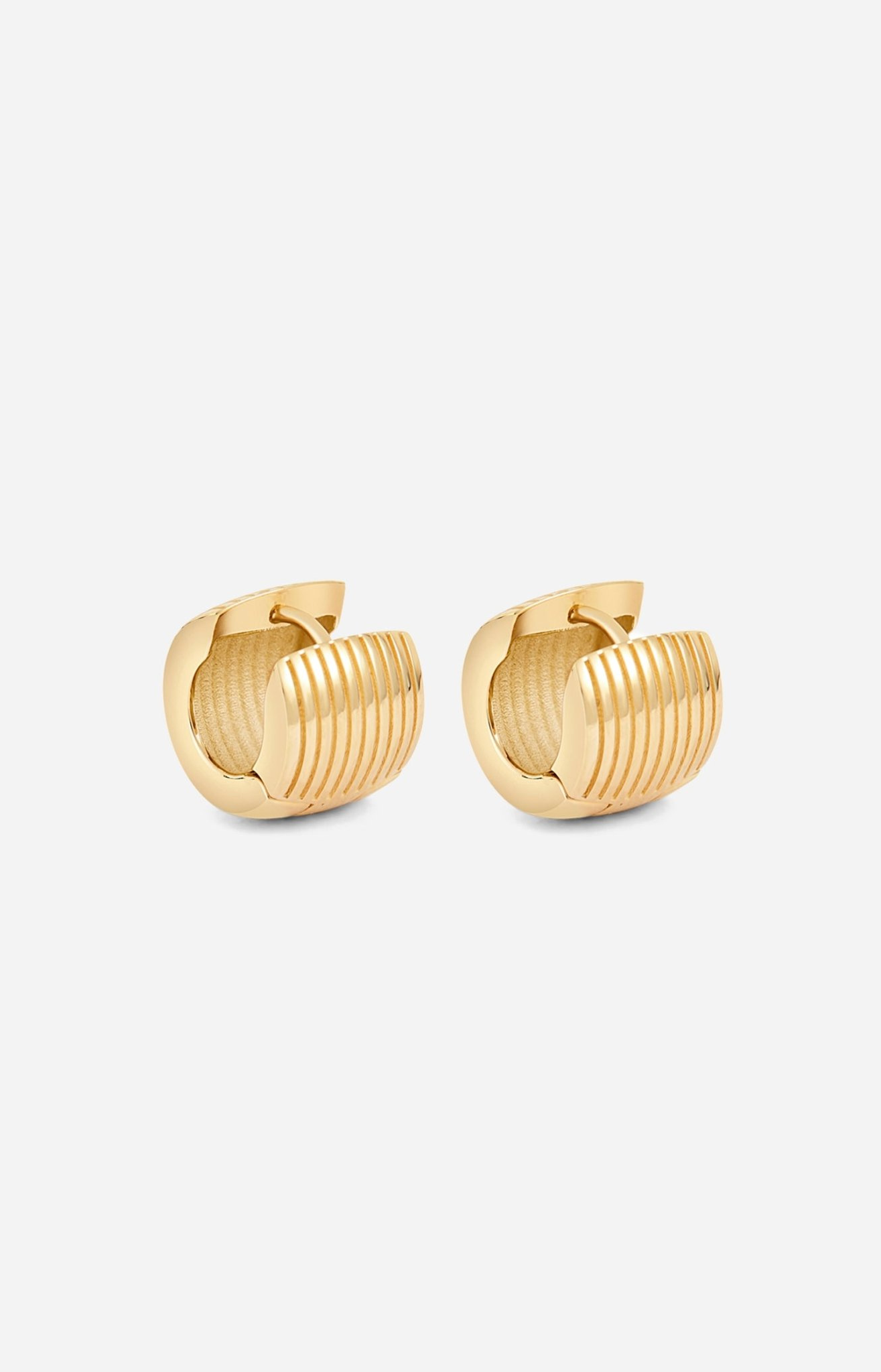 Gold hoop earrings on a white background