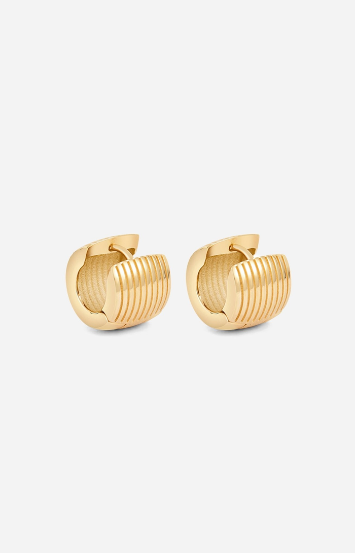 Gold hoop earrings on a white background