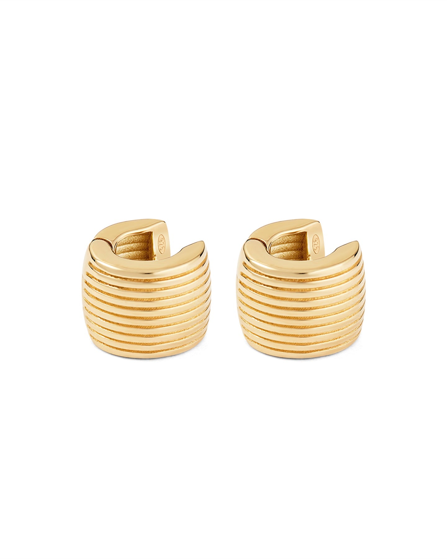 Gold hoop earrings with a white background