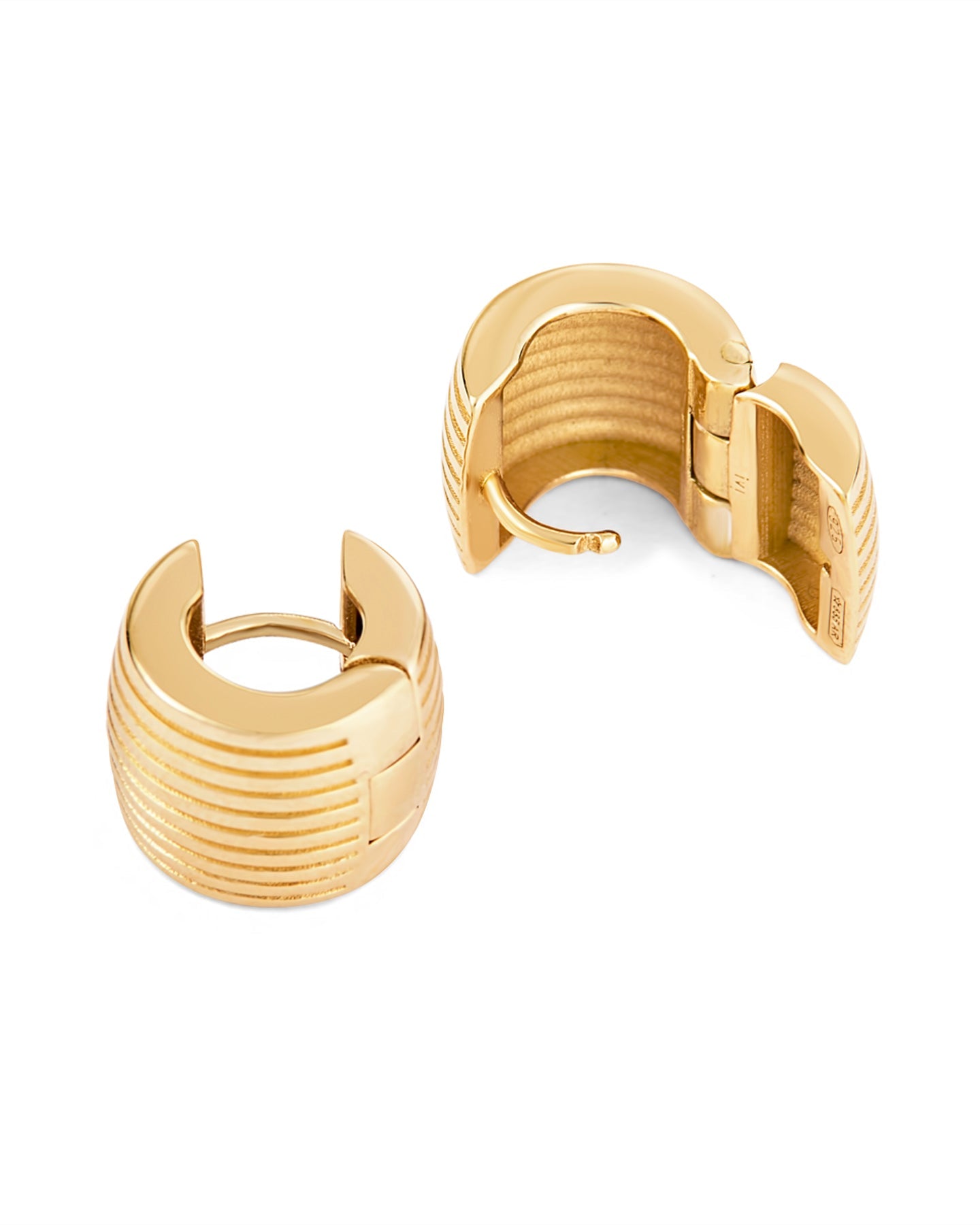 Gold hoop earrings with a white background