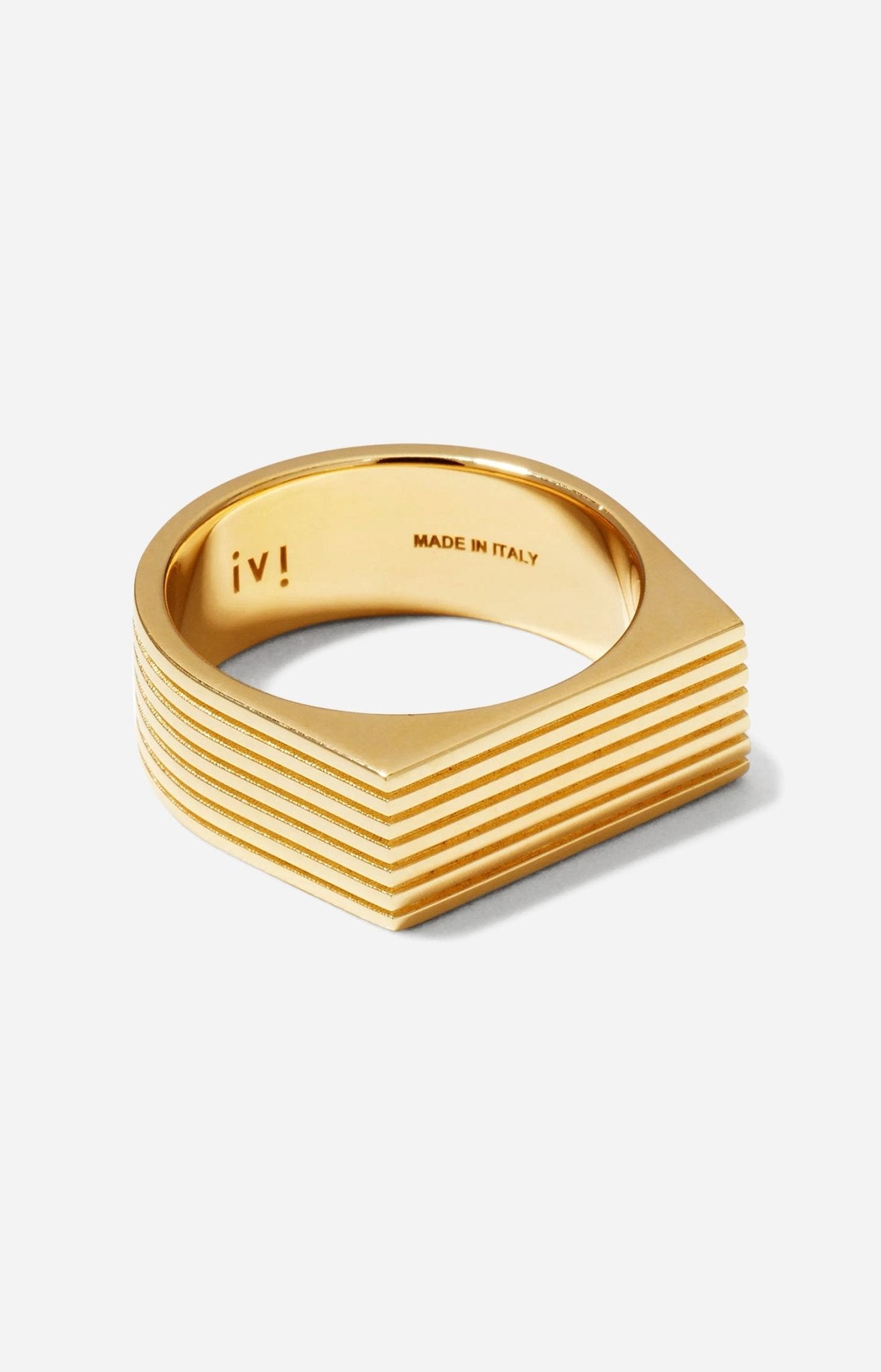A gold-plated signet ring with angular proportions
