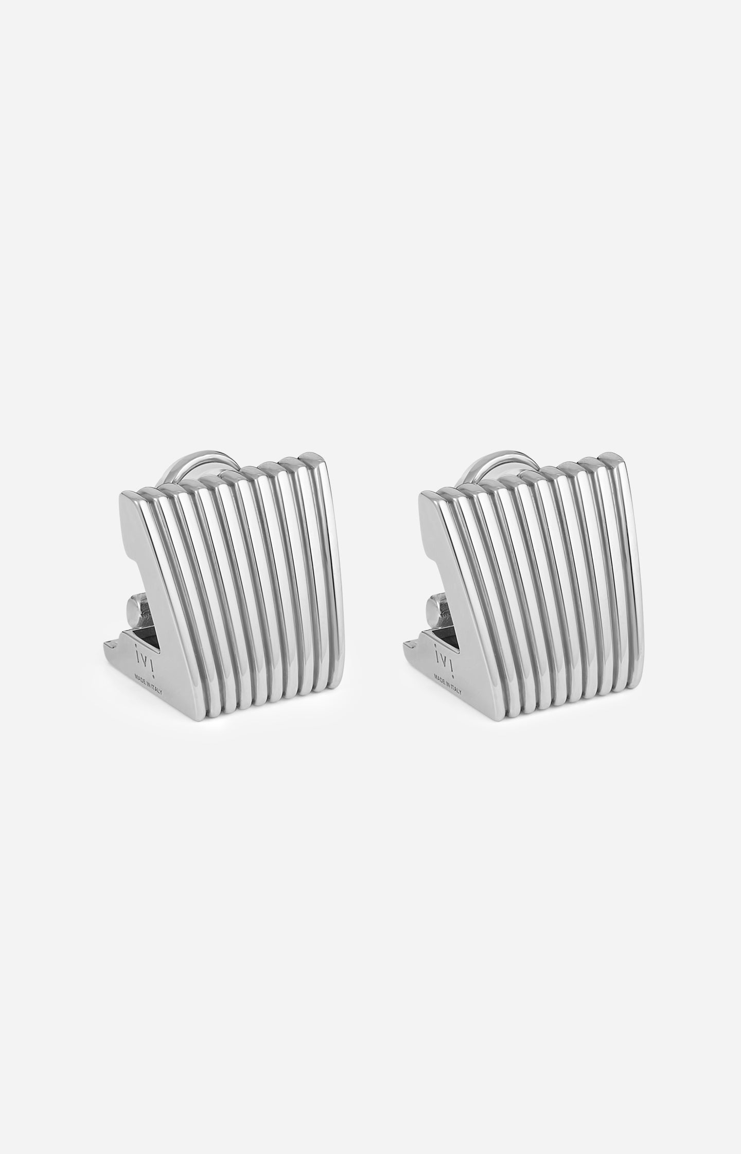 Pair of silver striped earrings on a white background