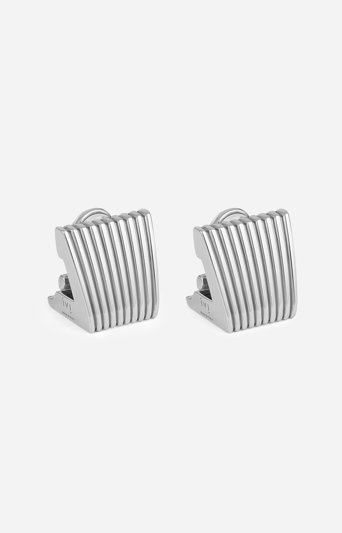 Pair of silver striped earrings on a white background