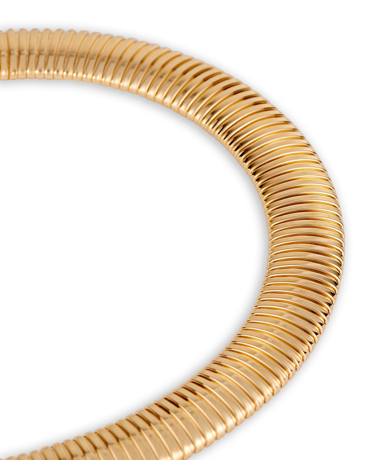 A close up of a gold-plated necklace with a flexible tubular design and a magnetic clasp.