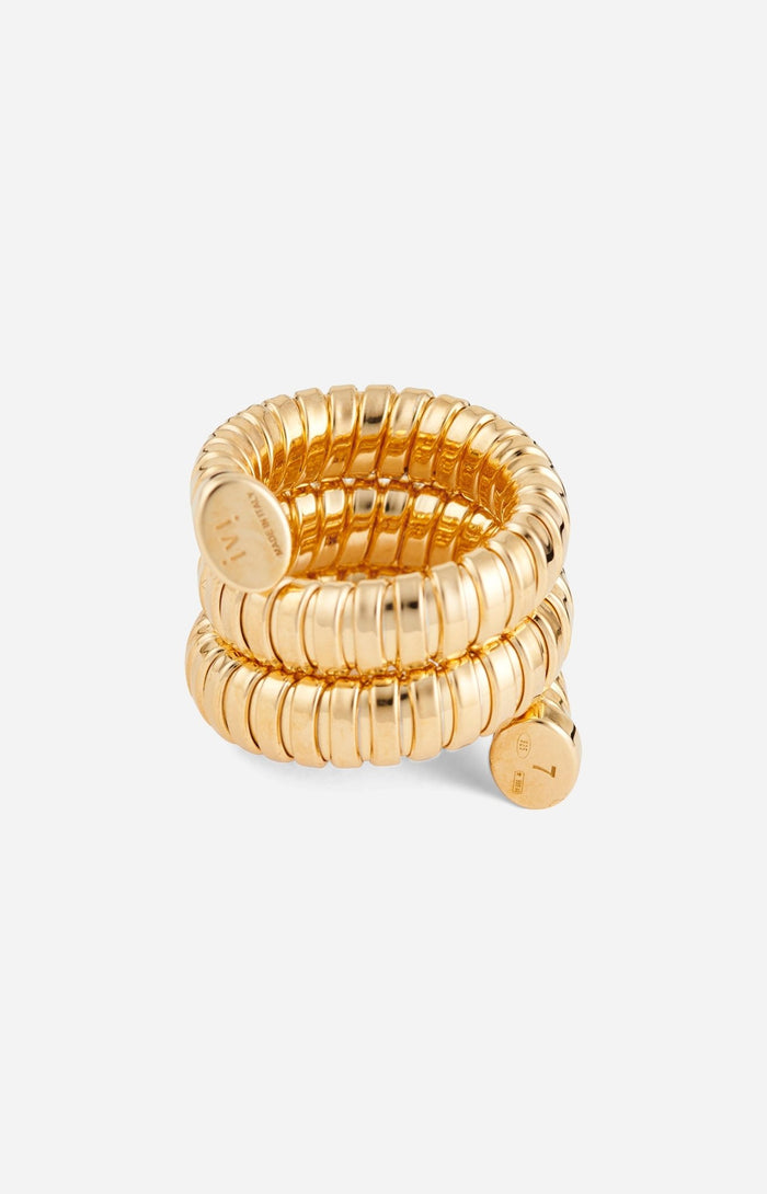 A gold-plated Gaia Triple Twist ring with a winding silhouette, displayed on a white background.