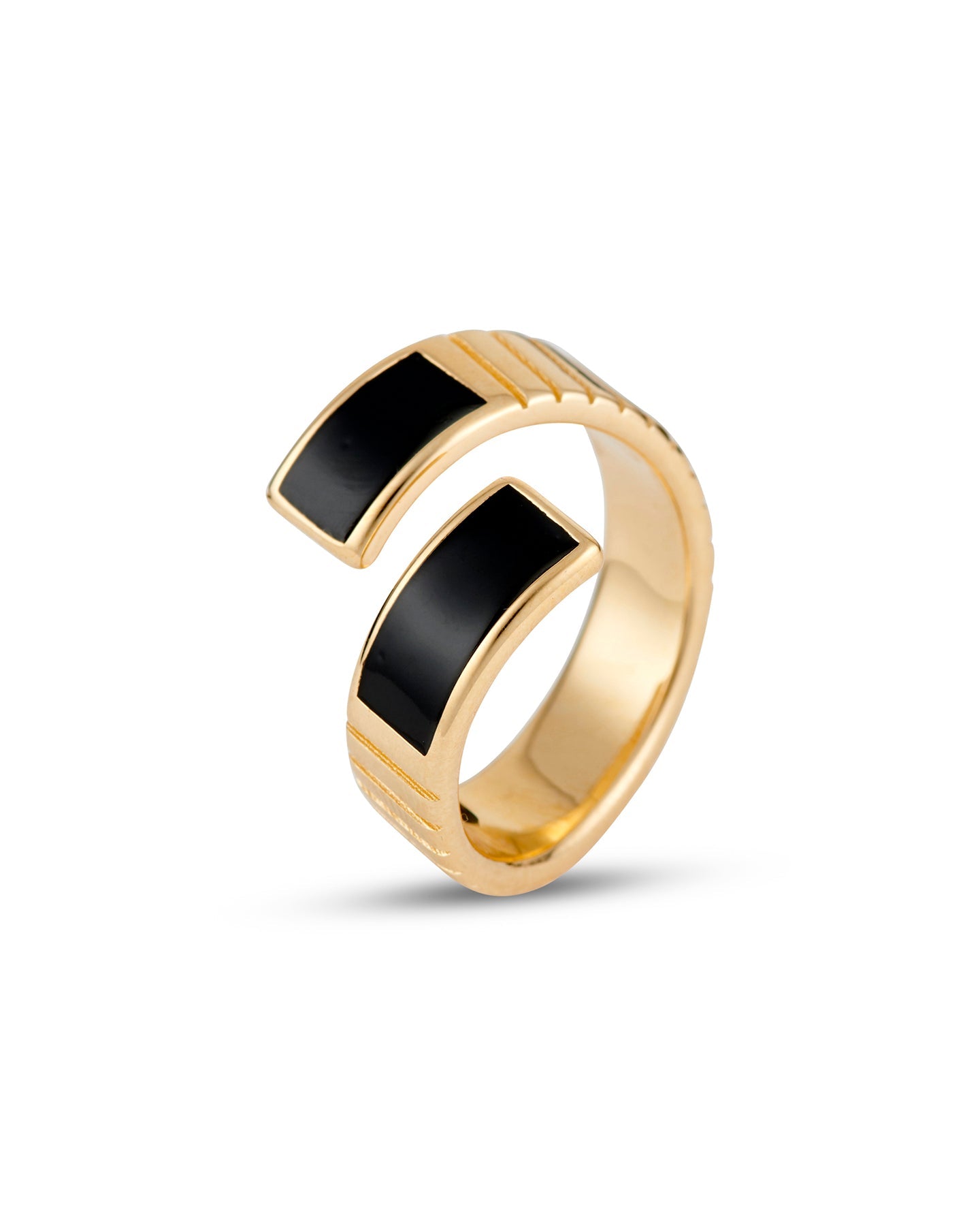 A gold-plated twist ring with polished black enamel stripes at the tips, with a textured surface and signature linear engravings.
