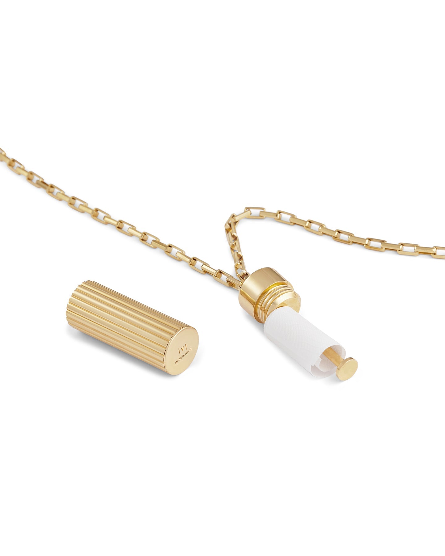Gold pendant necklace with a ridged cylindrical charm, shown open to reveal a hidden paper insert on a gold chain against a light gray background.