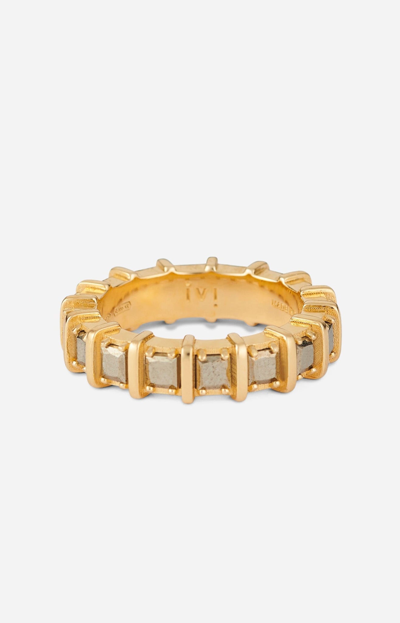 A gold-plated band ring with raised, squared frames set with shimmering pyrite stones.