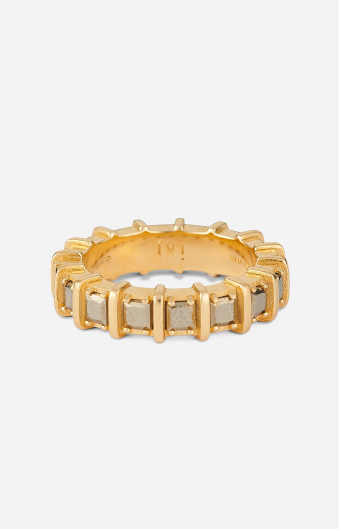 A gold-plated band ring with raised, squared frames set with shimmering pyrite stones.