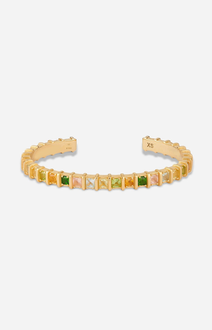 Gold-plated open cuff bracelet set with multicolored natural gemstones in raised square settings.