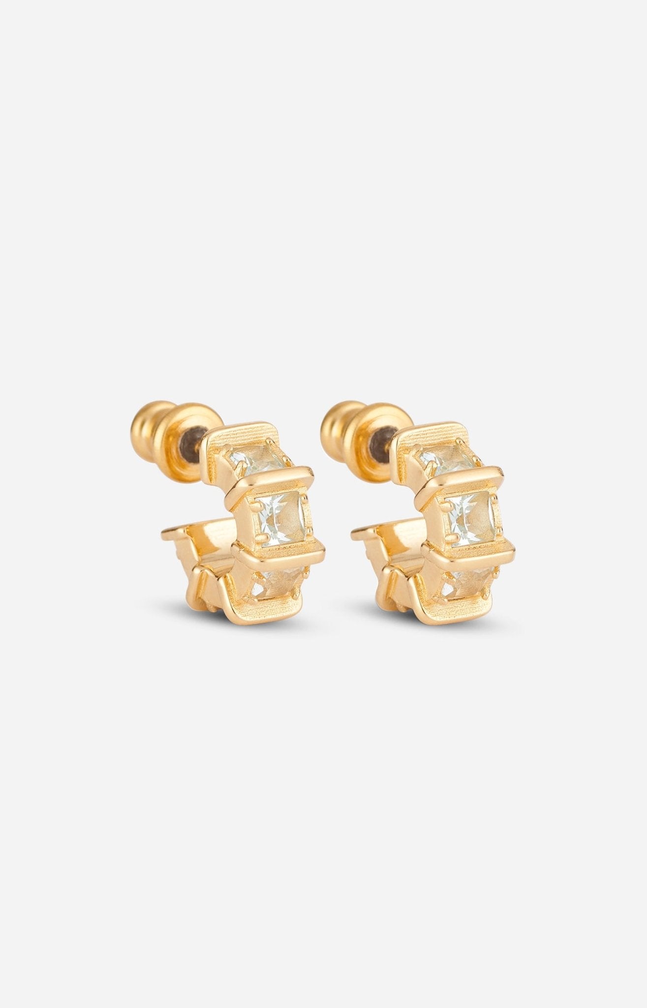 A pair of gold-plated mini iris hoop earrings with blue apatite accents.