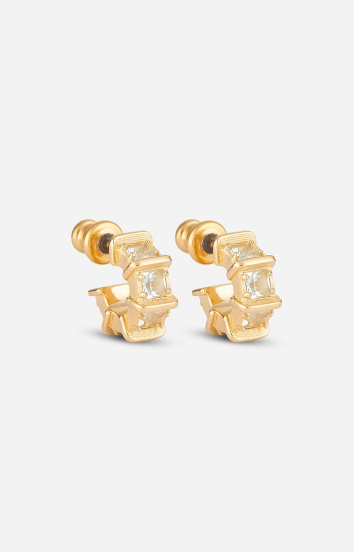 A pair of gold-plated mini iris hoop earrings with blue apatite accents.