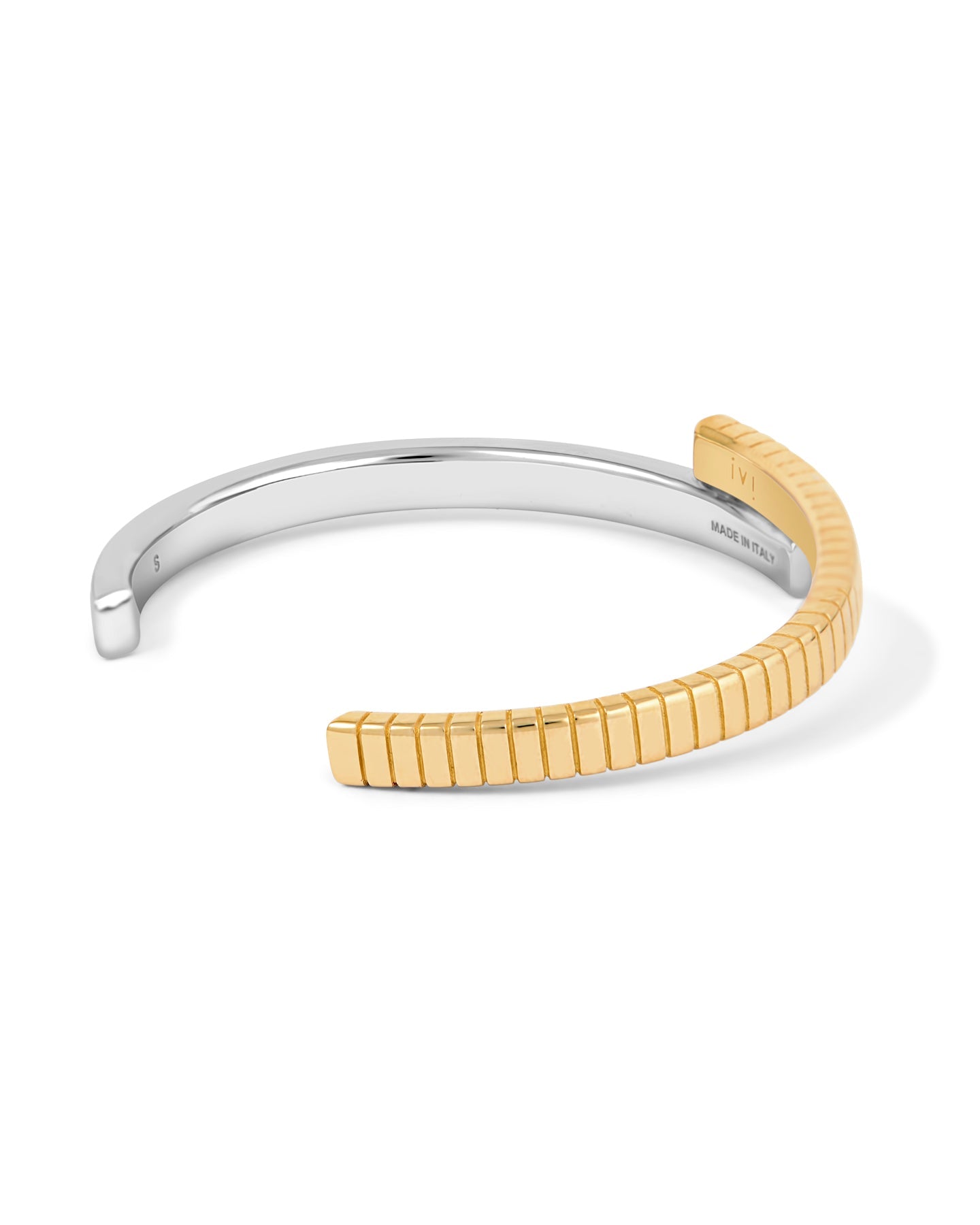 A two-tone (gold and silver) twist cuff bracelet with a mixed-metal finish.