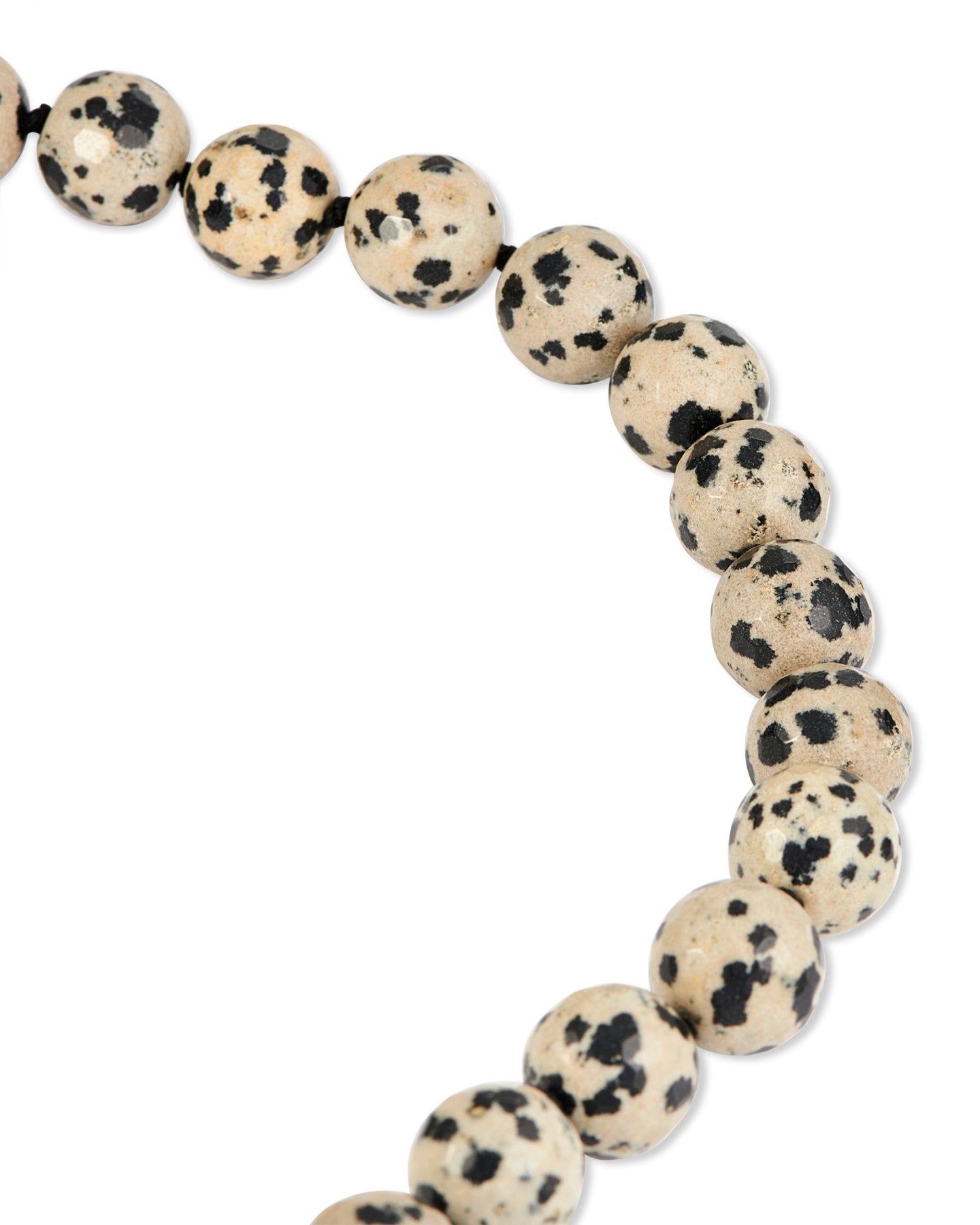 Necklace with dalmatian jasper beads and silver clasp on a white background