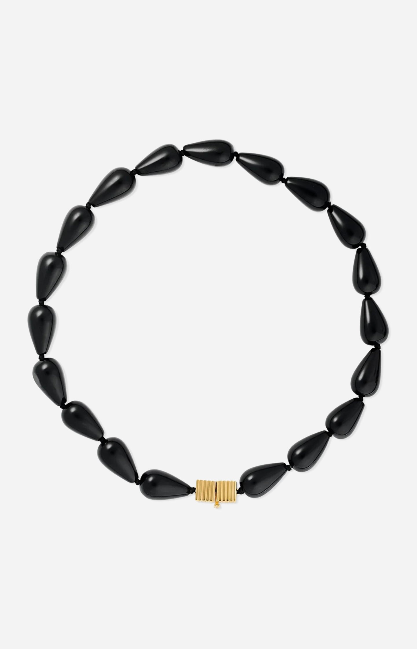 Black teardrop-shaped beaded necklace featuring glossy black beads and a gold clasp, photographed on a white background.