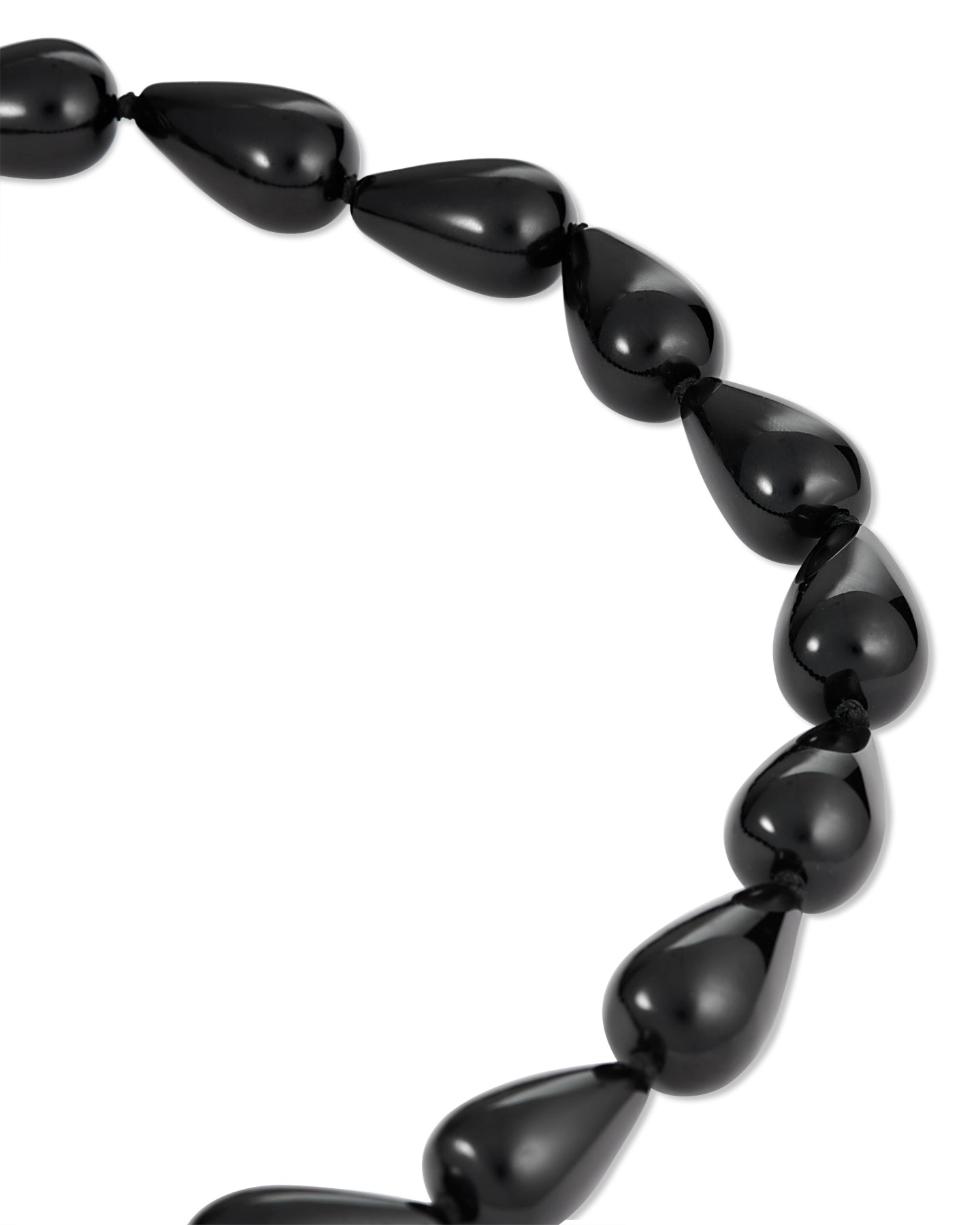 Black teardrop-shaped beaded necklace featuring glossy black beads and a gold clasp, photographed on a white background.