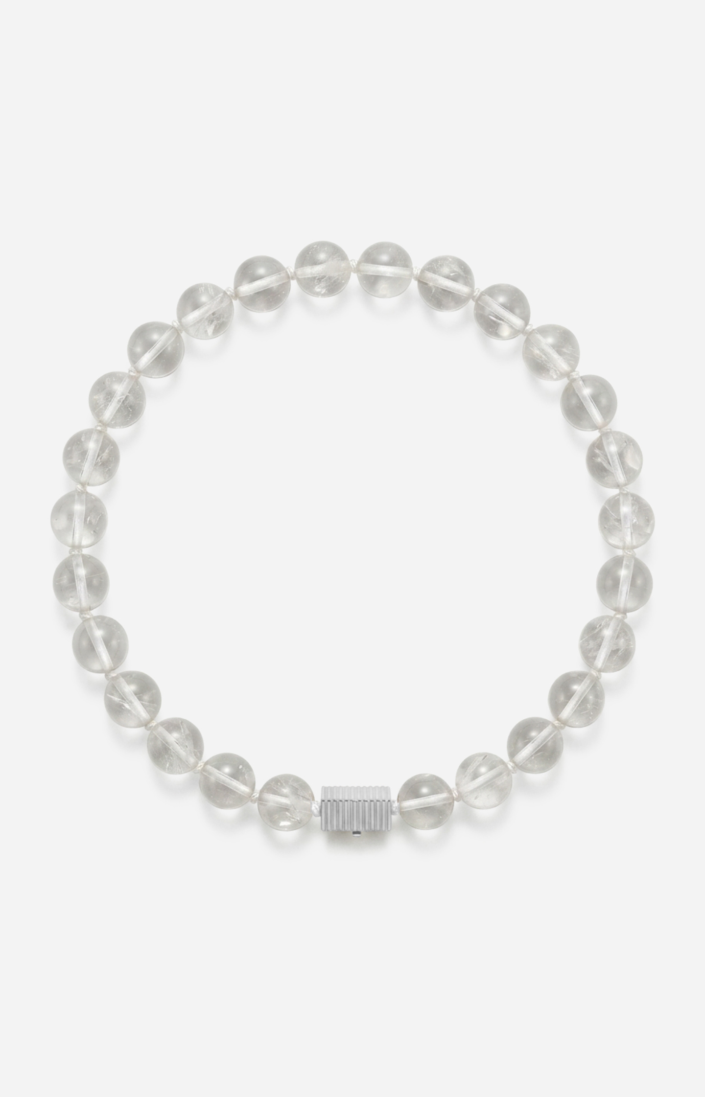 Crystal quartz beaded necklace with a silver clasp on a white background
