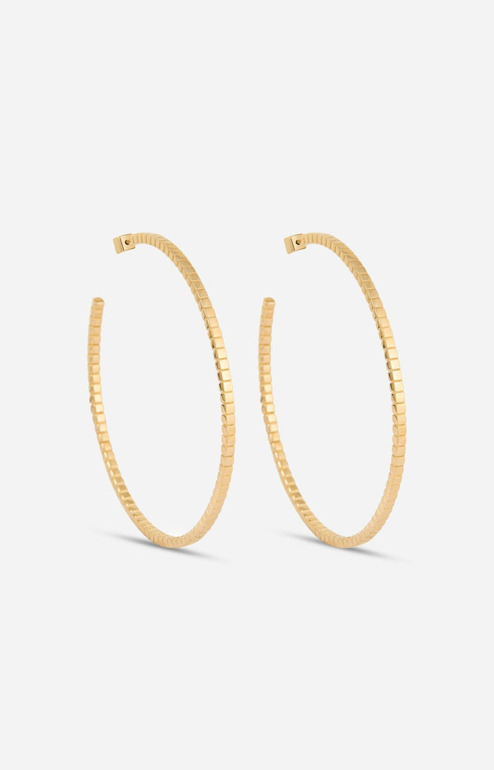 A pair of gold-plated Signore hoop earrings with a textured design, resembling a curving row of square beads.