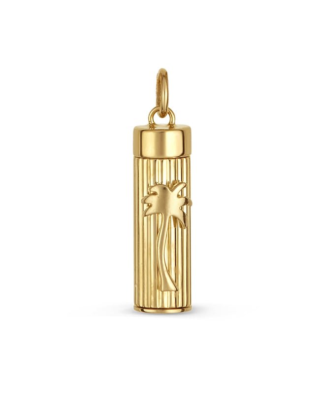Gold necklace with a cylindrical pendant featuring a palm tree motif on a white background.