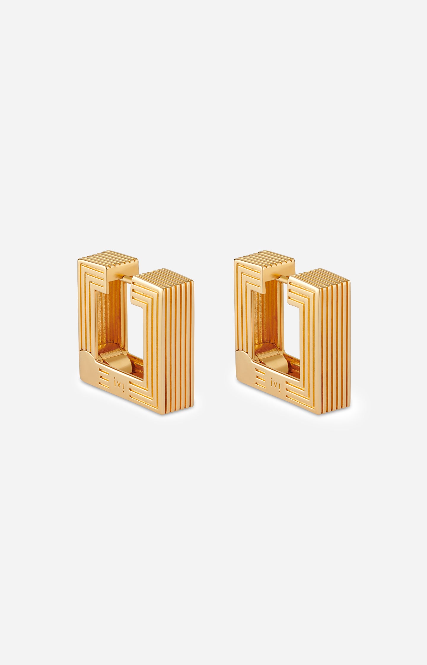 Pair of gold-plated medium Aurelia sculptural square hoop earrings on a white background.