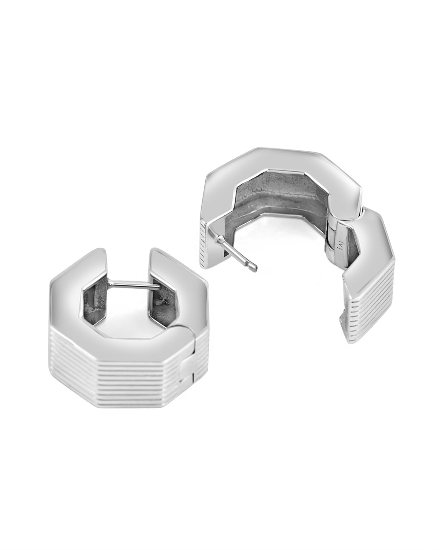 A pair of rhodium-plated medium-sized octagon hoop earrings with linear engravings.