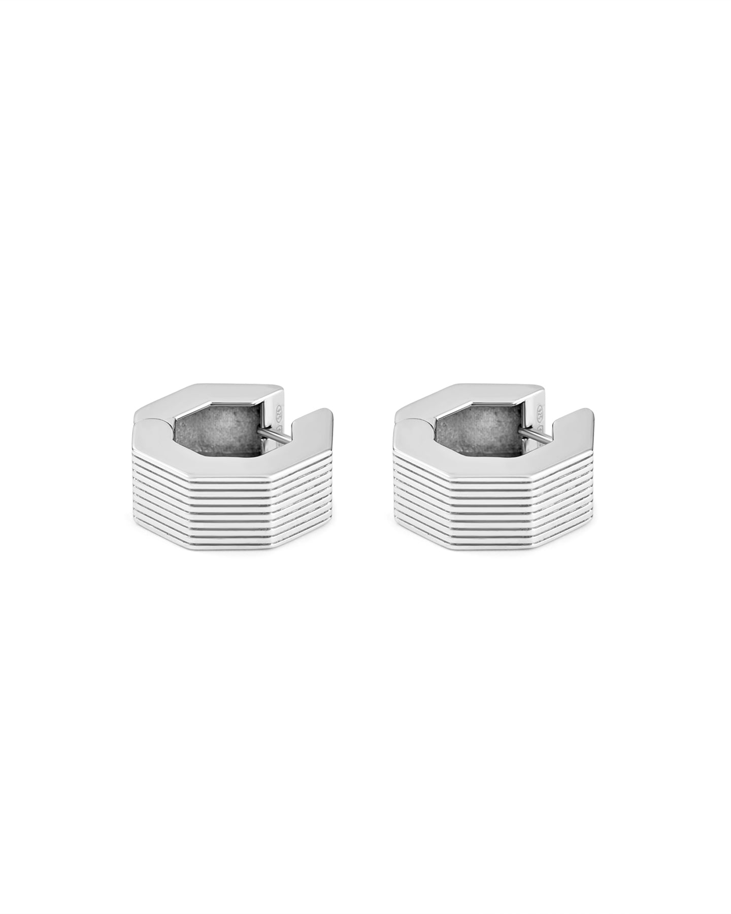 A pair of rhodium-plated medium-sized octagon hoop earrings with linear engravings.