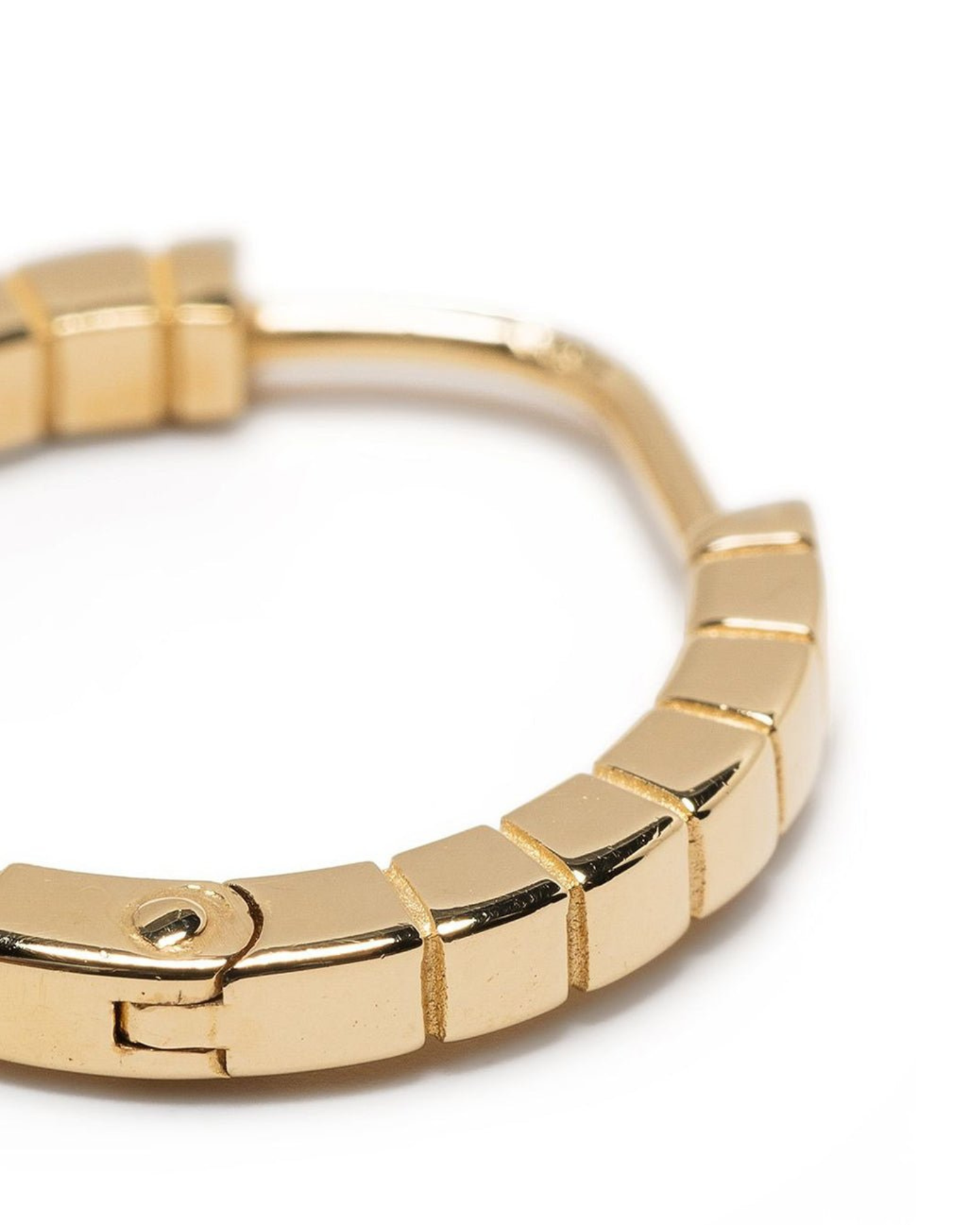 A pair of medium gold-plated Signore hoop earrings with a textured design, resembling a curving row of square beads.
