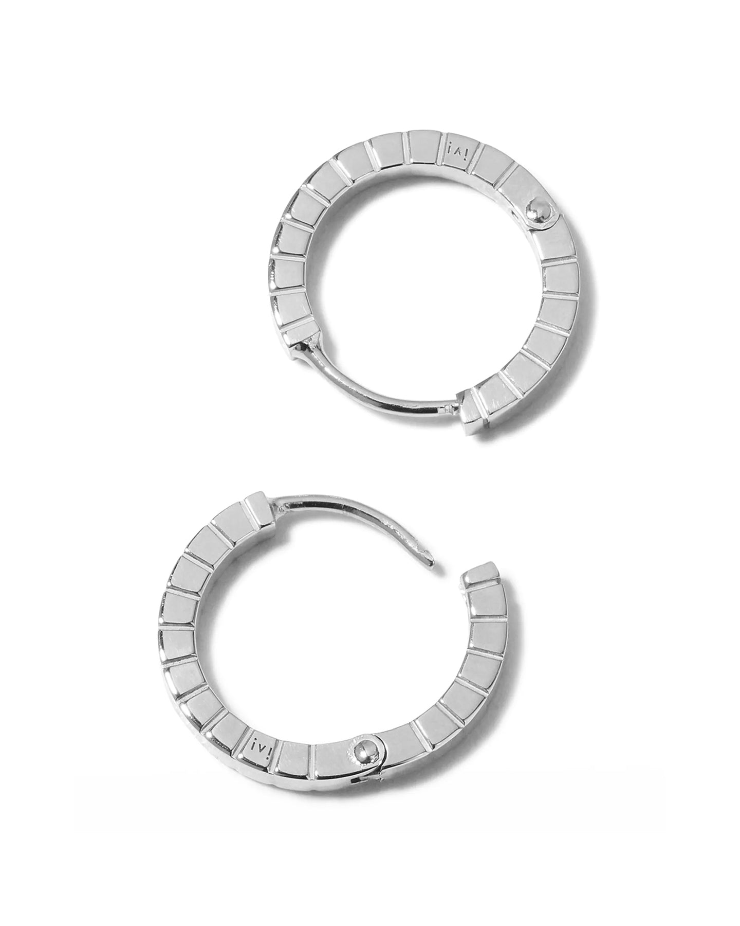 A pair of medium rhodium-plated Signore hoop earrings with a textured design, resembling a curving row of square beads.