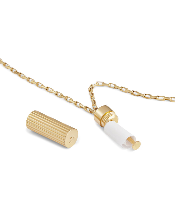 Gold pendant necklace with a ridged cylindrical charm, shown open to reveal a hidden paper insert on a gold chain.