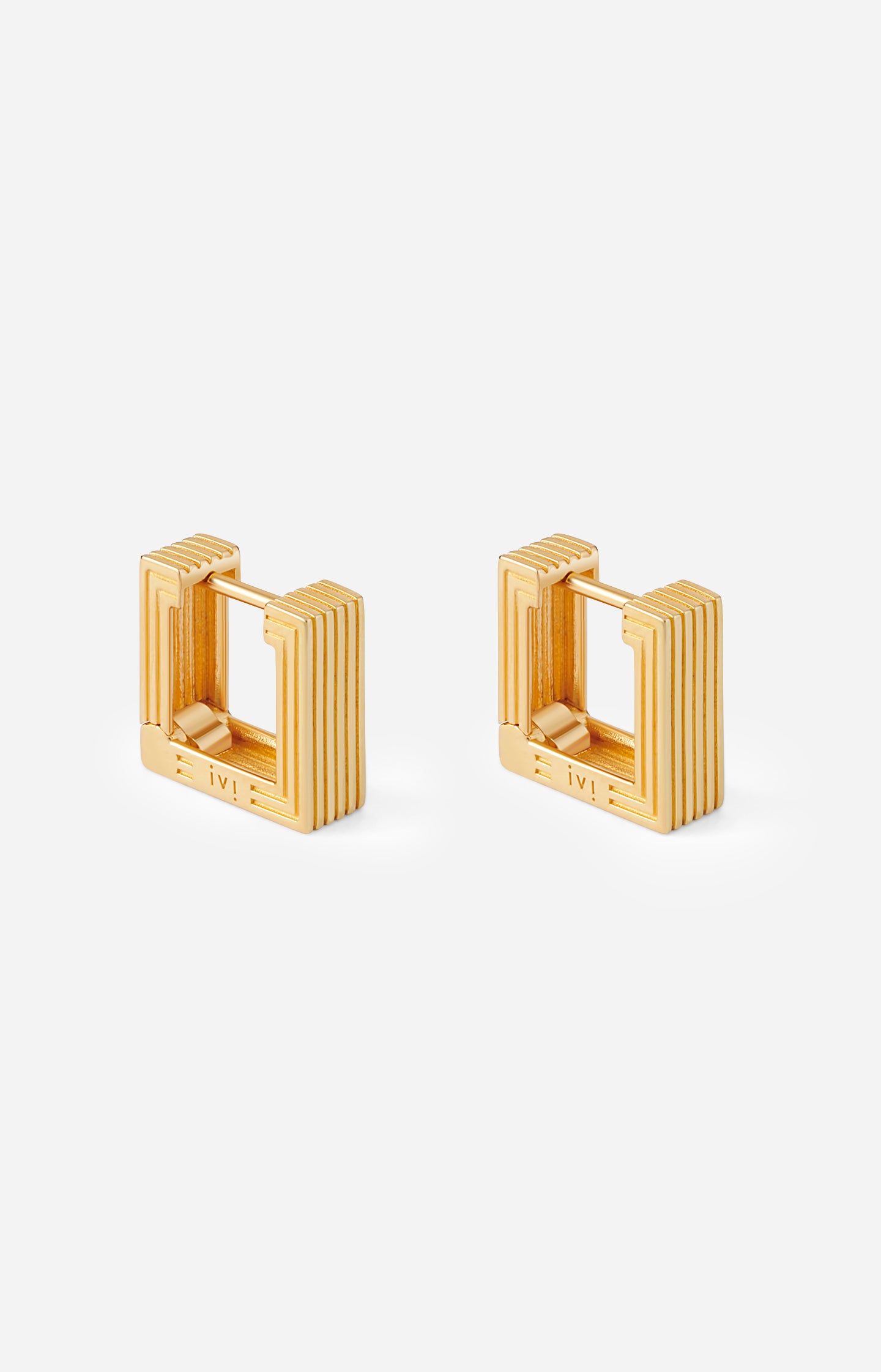 Pair of gold-plated Mini Aurelia sculptural square hoop earrings on a white background.