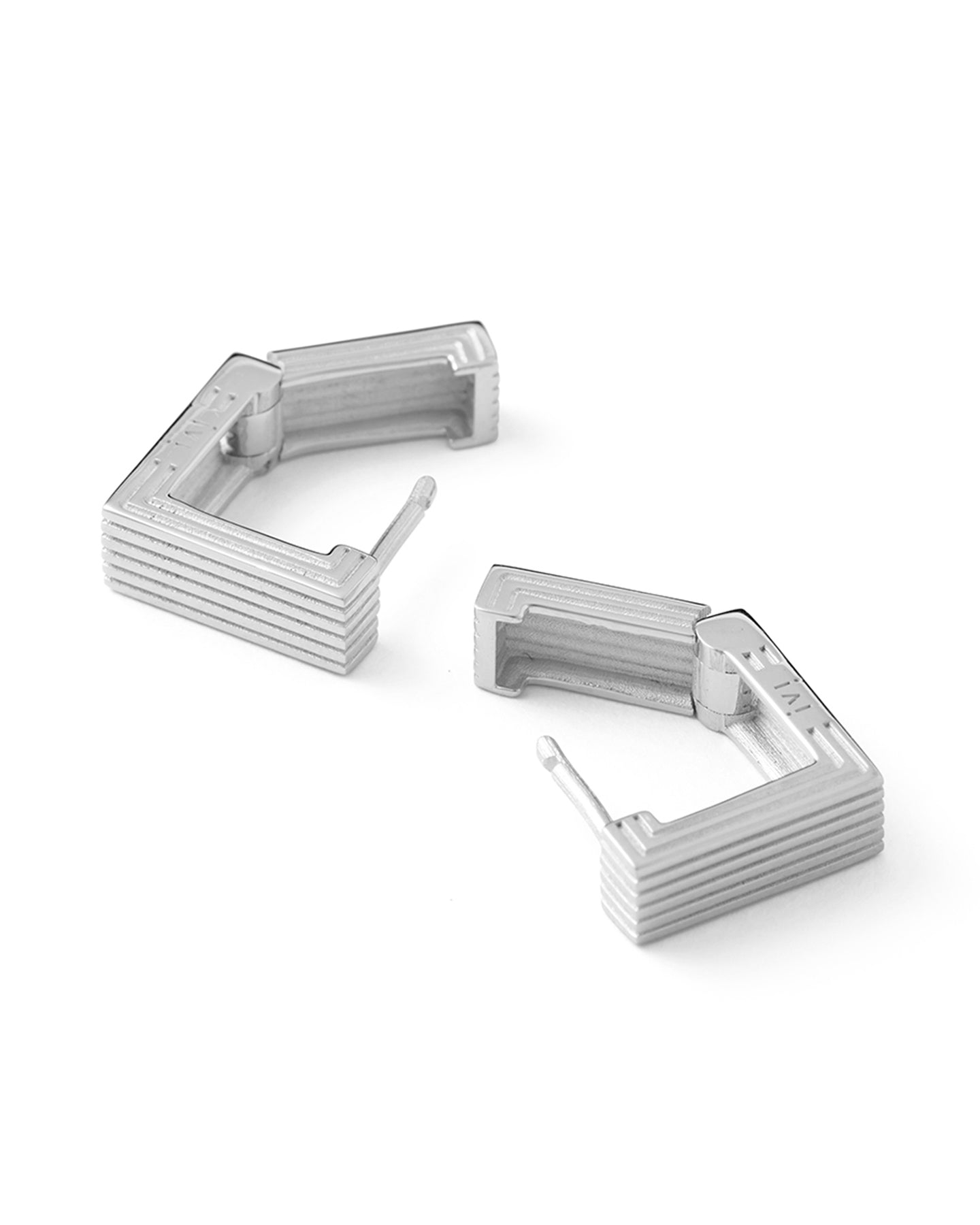 Pair of rhodium-plated Mini Aurelia sculptural square hoop earrings on a white background.