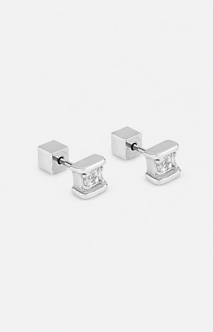 Pair of silver square stud earrings with clear gemstones on a white background