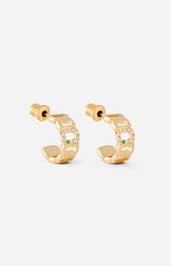 A pair of mini toy hoop earrings crafted from 18-karat gold, featuring oval links adorned with diamonds and an emerald.