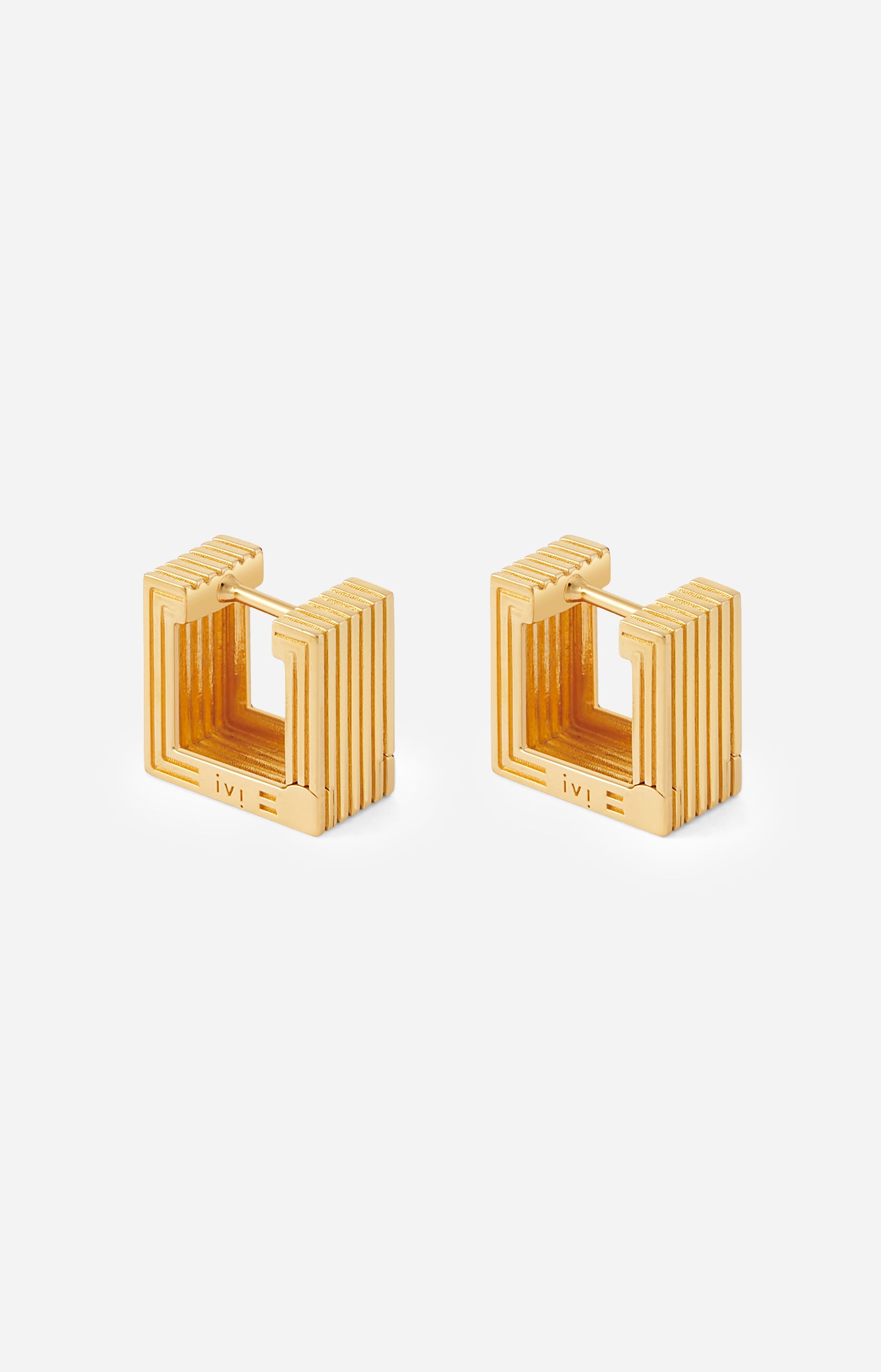 Pair of gold-plated Mini Wide Aurelia sculptural square hoop earrings on a white background.