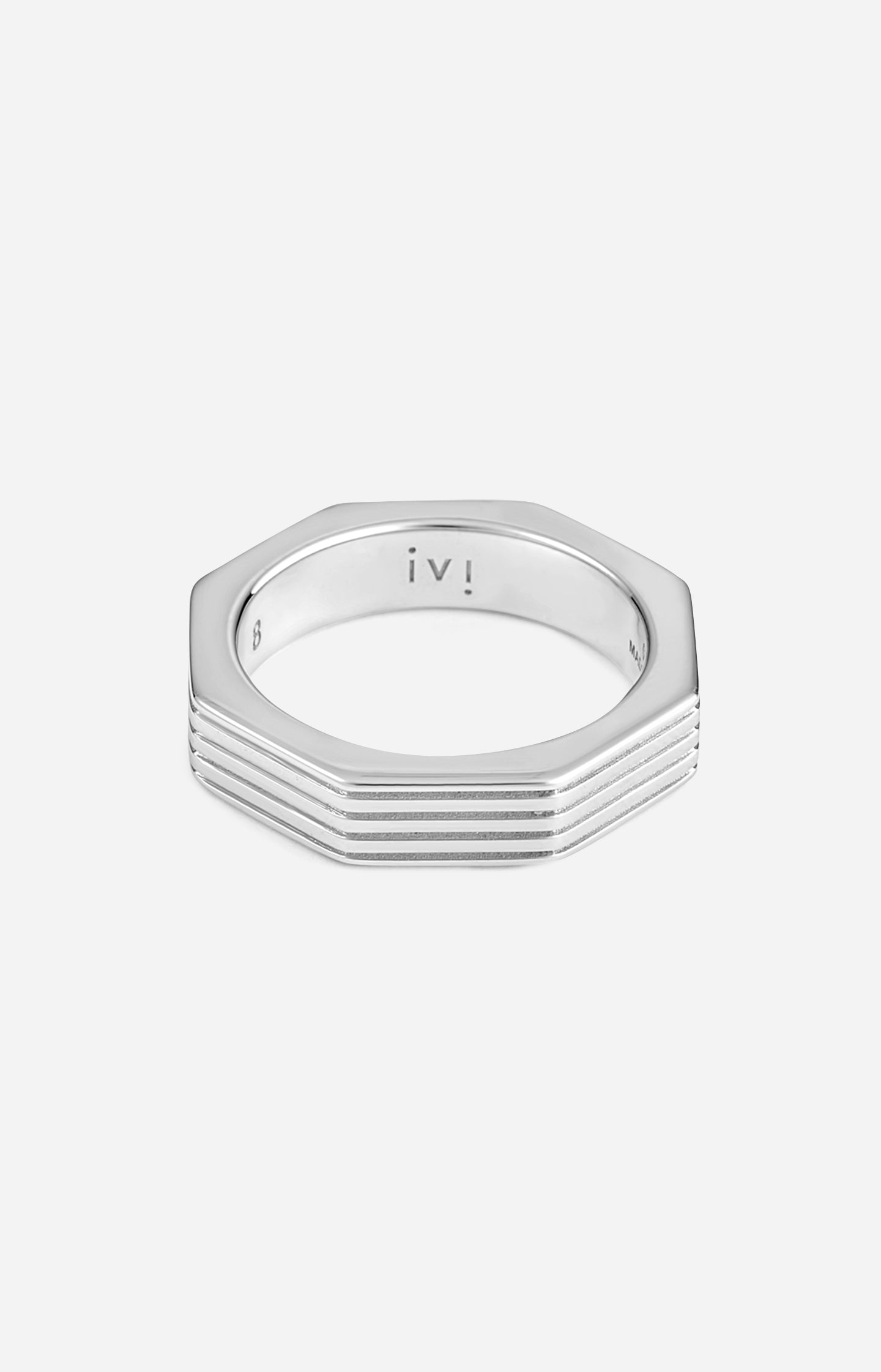 Hexagonal rhodium-plated ring on a white background