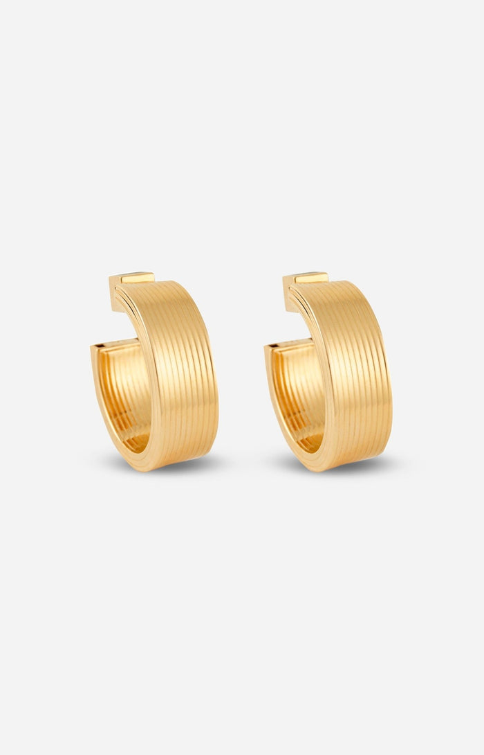 A pair of gold-plated hollow hoop earrings with a square post, displayed on a white background.