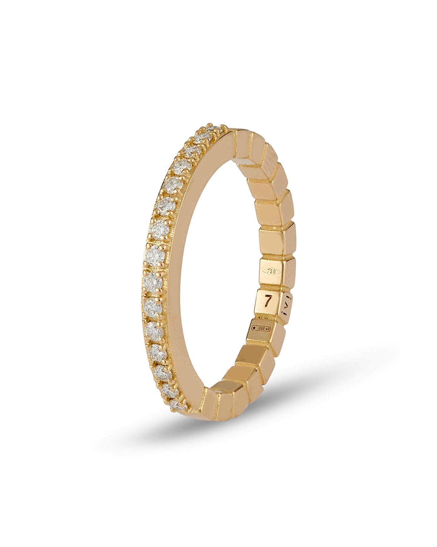 An 18-karat gold band ring with round-cut diamonds set on a white background.